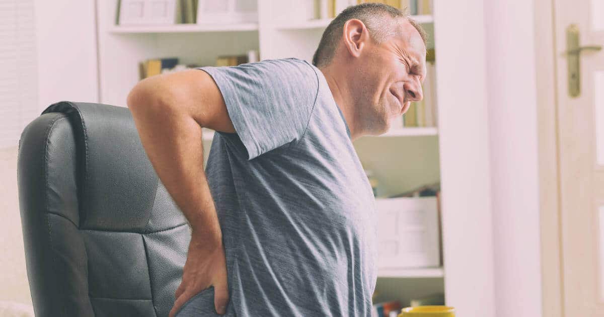 Man with lumbar spine pain