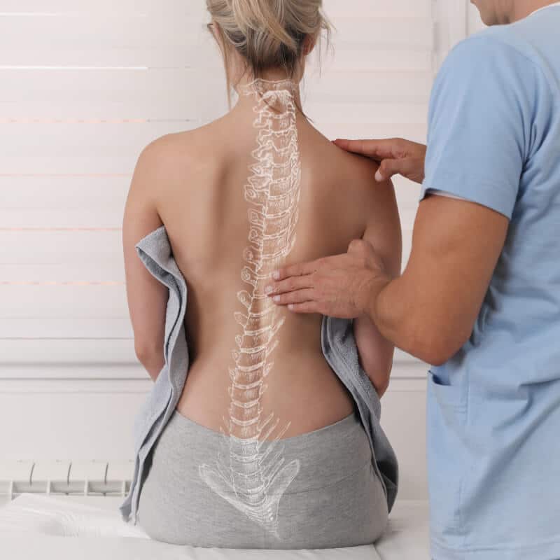 You can see a woman with a deformed spine projected onto her back.