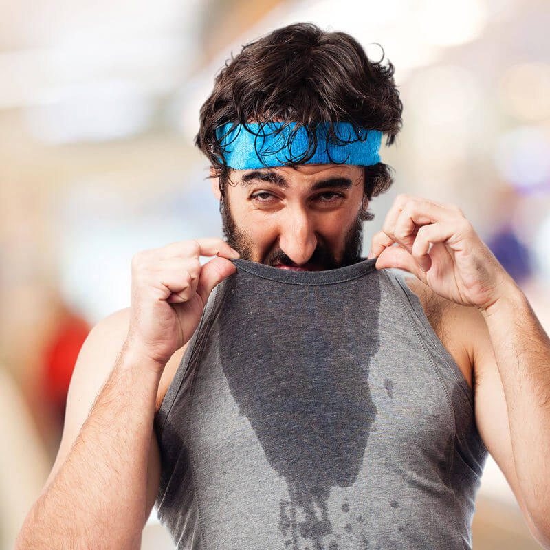 A man is sweating a lot after exercising.