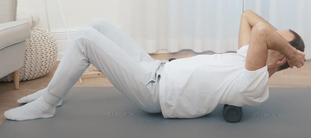 Roland is massaging his upper backside.