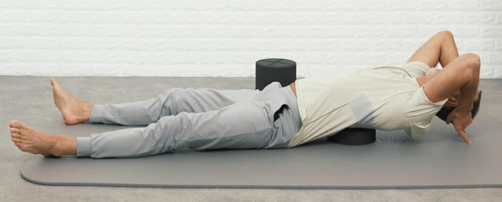 Roland is using the Back Hero to stretch his thoracic spine to relieve his back pain.