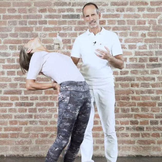 A woman is demonstrating a pelvic thrust stretch.