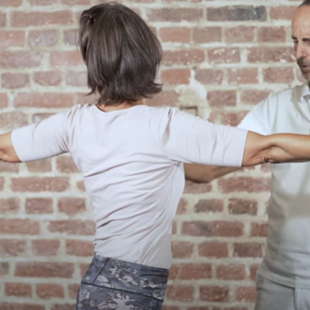 A woman demonstrates bulging disc exercise 3.