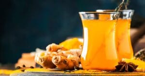 image of healthy vegan tea recipe containing turmeric, ginger, honey and lemon