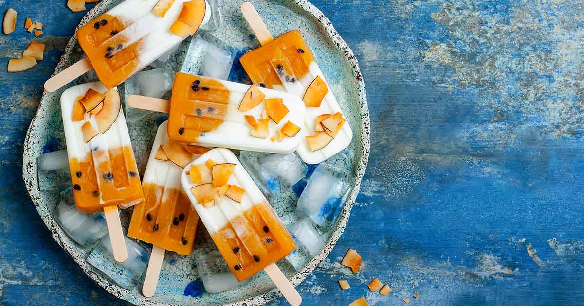 image of mango & passion fruit anti-inflammatory ice lollies on plate