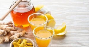 image of immune boosting shot containing honey, lemon, ginger and turmeric