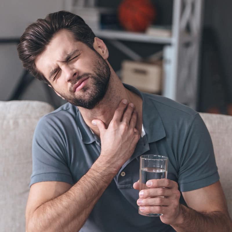 A man is suffering acid reflux.