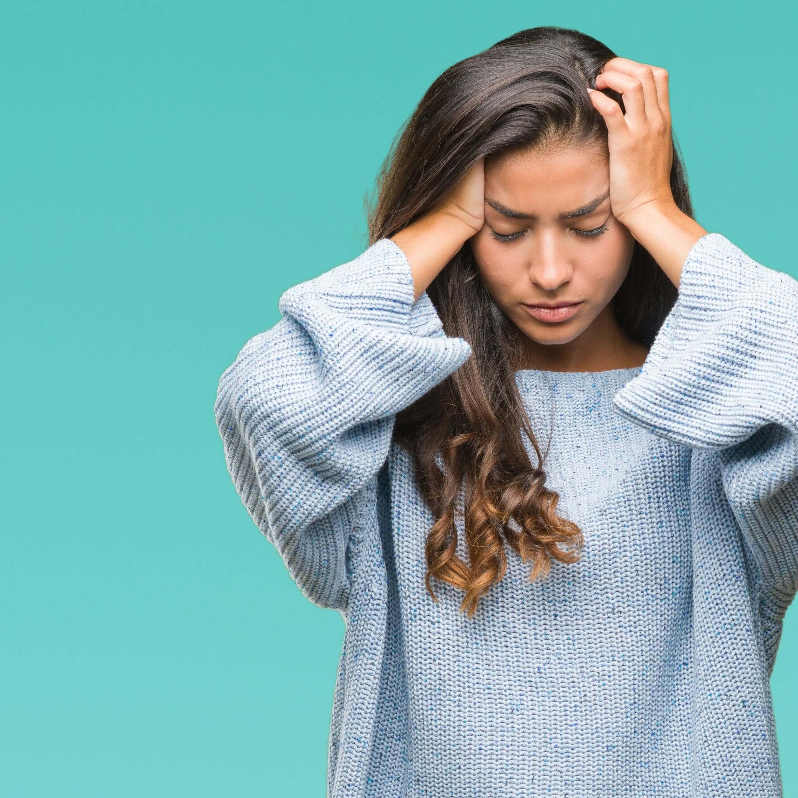 image of young woman showing concern or pain