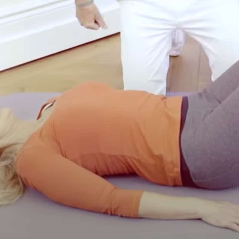 Ina demonstrates a stretch for ankylosing spondylitis.