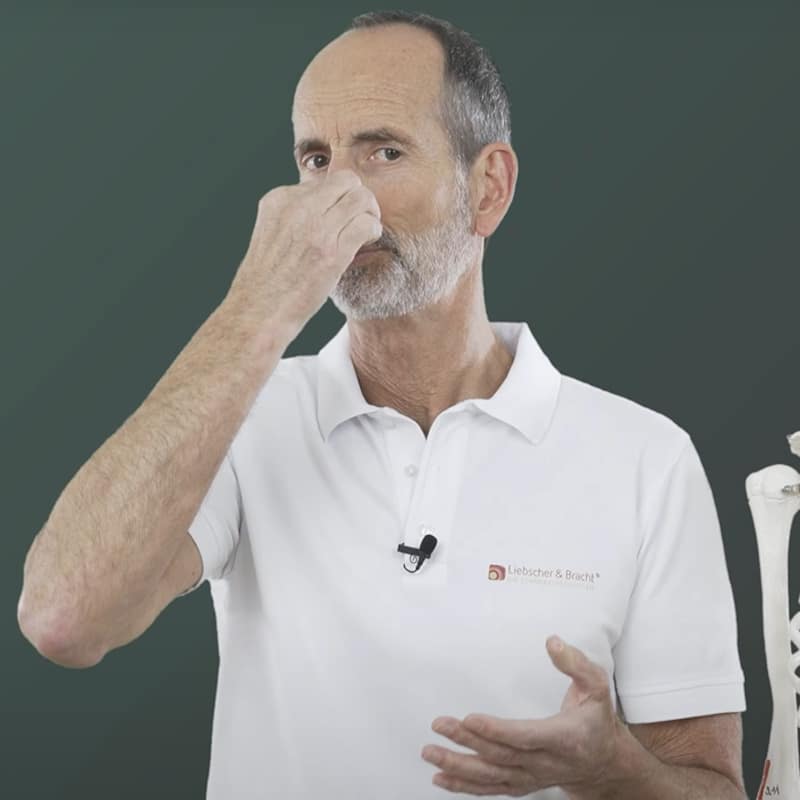 Roland demonstrates heartburn breathing exercise.