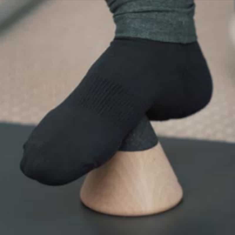 Close-up of a foot pressing against the Osteopressure tool.