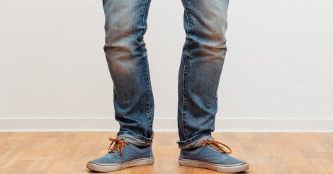 Closeup of a man with bowlegs.