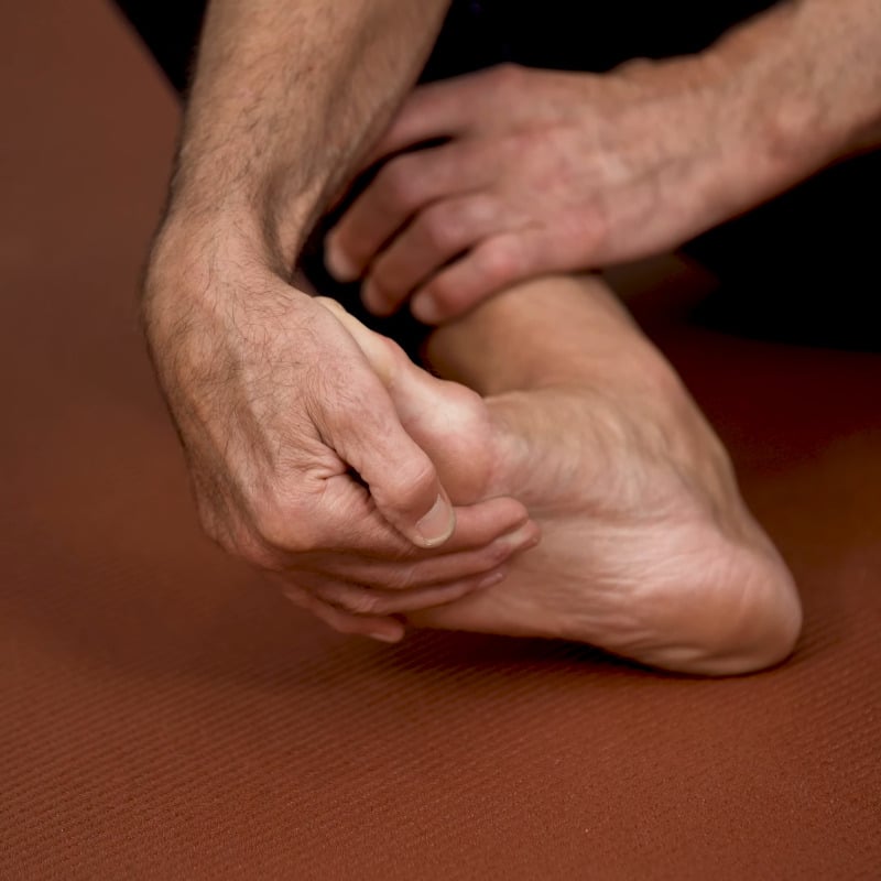 Roland Liebscher-Bracht is pulling his toes into extension.