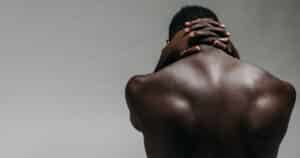 Closeup of a man's upper back.