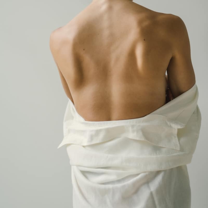 Closeup of a woman's lower back.