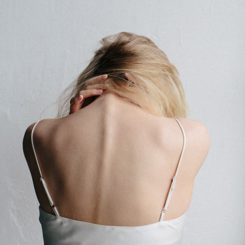 Closeup of a woman's upper back.