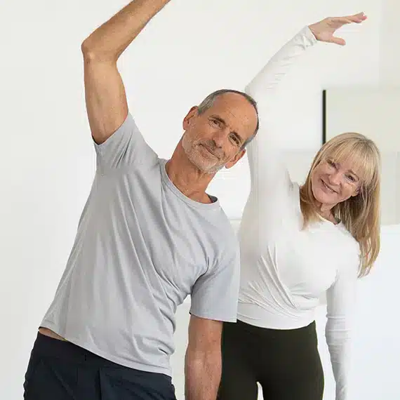 Close up of Roland and Petra stretching.