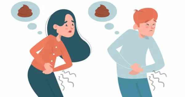 Eine junge Frau und ein junger Mann halten sich auf der Grafik die Bäuche. Sie müssen auf Toilette